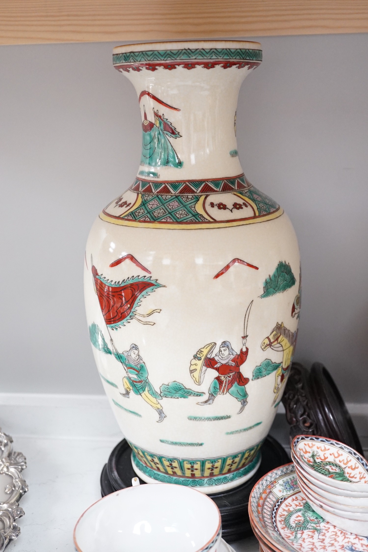 A Gien pottery jug, a Chinese crackle glaze baluster vase, egg-shell tableware and three Oriental wood stands